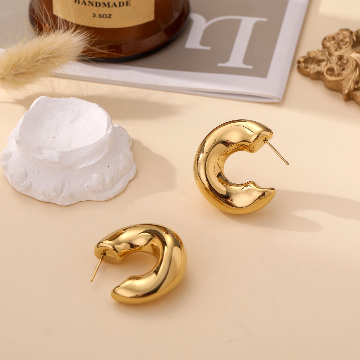 Boucles d’oreilles dorées bombées