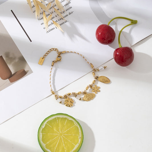 Bracelet cordon et charms dorés