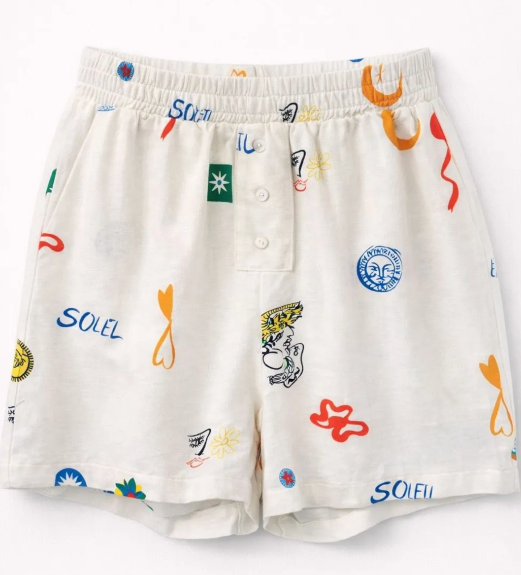 Short Capucine blanc imprimé motifs colorés soleil et symboles graphiques, coupe fluide taille élastique femme été