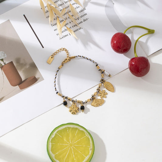 Bracelet cordon et charms dorés