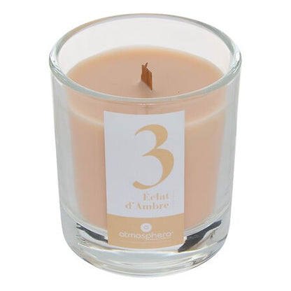 Bougie parfumée Numia Éclat d'Ambre couleur beige dans verre transparent décoration intérieure ambiance cosy