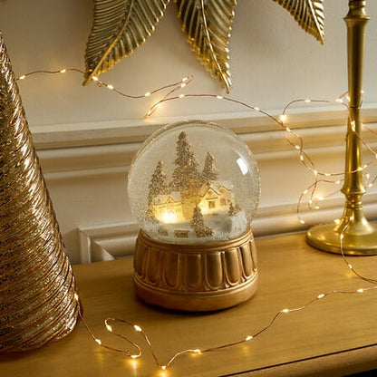Boule à neige lumineuse ville diam 15 cm - Décor doré LED