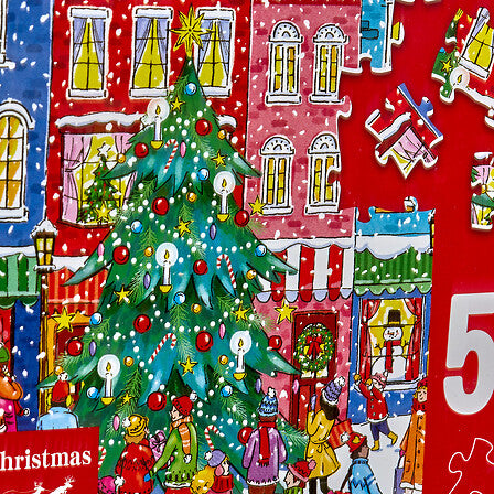 Puzzle Noël 500 pièces illustration sapin décoré village enneigé maisons colorées ambiance fêtes décoration Noël traditionnel