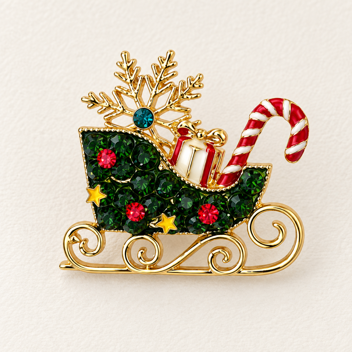 Broche traineau Père Noël dorée cristaux verts rouges avec flocon sucre d'orge accessoire fantaisie fêtes femme