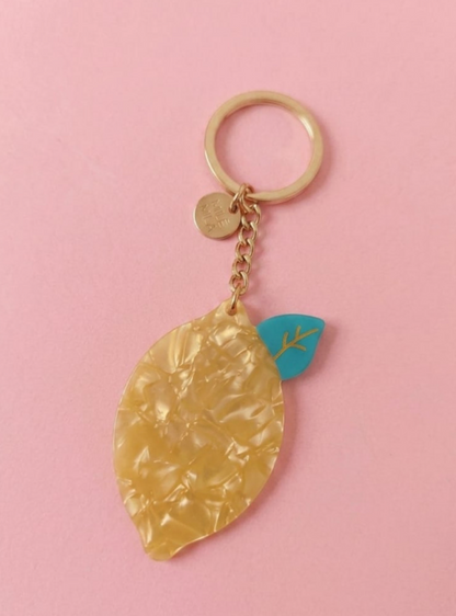 Porte-clés fantaisie citron en résine marbrée jaune avec feuille turquoise et anneau doré accessoire femme tendance
