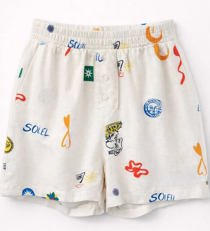 Short Capucine blanc imprimé motifs colorés soleil et symboles graphiques, coupe fluide taille élastique femme été