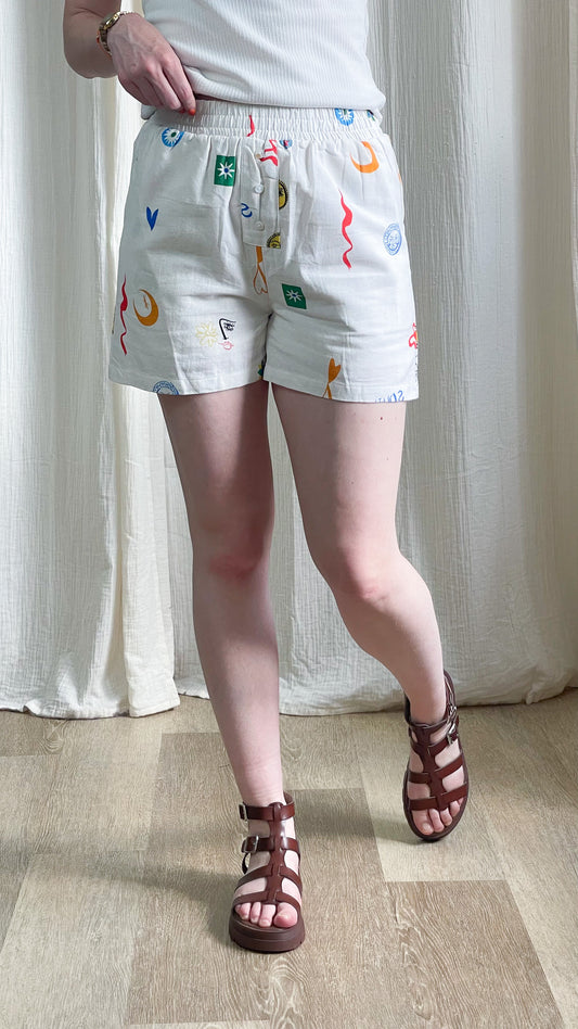 Short Capucine blanc imprimé motifs colorés graphiques taille élastique boutons femme été style décontracté