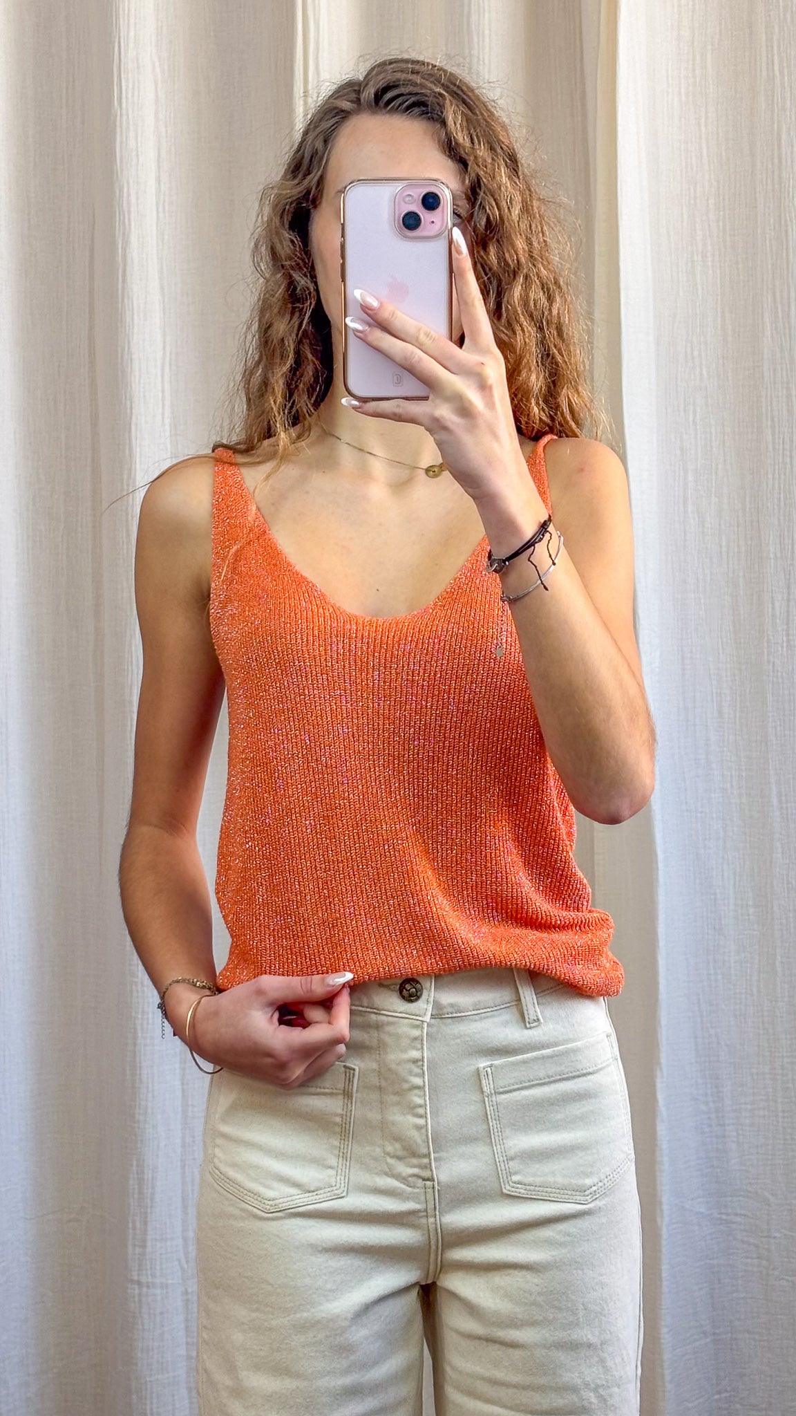 Top débardeur orange à paillettes en maille lurex fine bretelles femme style été chic