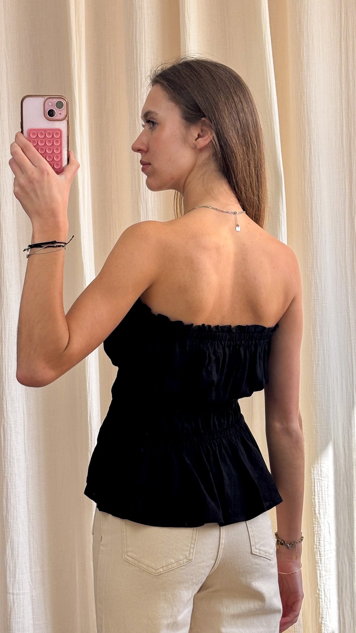 Top Laure – Top bustier noir smocké à volants
