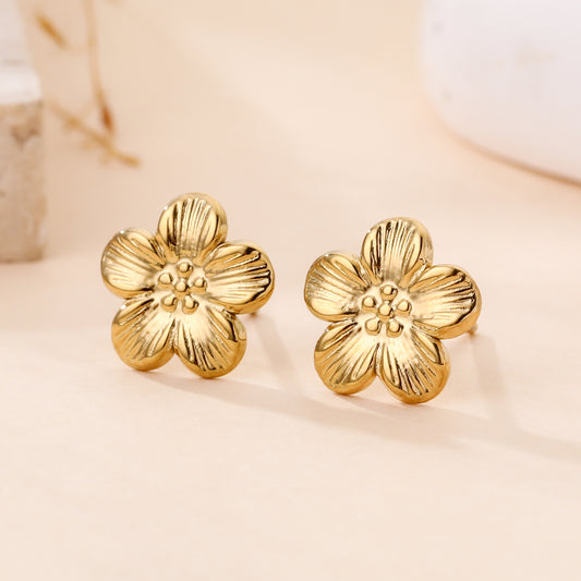 Boucles d'oreilles fleur dorées effet métal texturé style bohème chic femme bijou fantaisie tendance