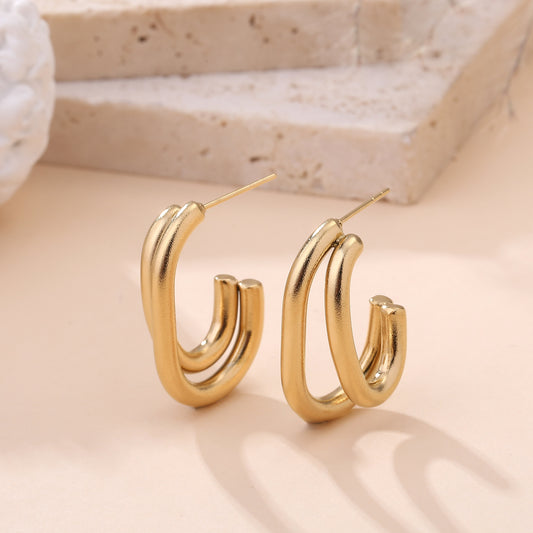 Boucles d'oreilles créoles dorées double anneau ouvert style minimaliste femme bijou tendance