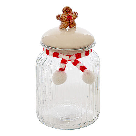 Pot à biscuit en verre strié avec couvercle beige surmonté d'un bonhomme pain d'épices et ruban rouge blanc déco Noël