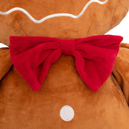 Peluche pain d'épice géante marron avec nœud papillon rouge velours et détails glaçage blanc décoration Noël 100cm