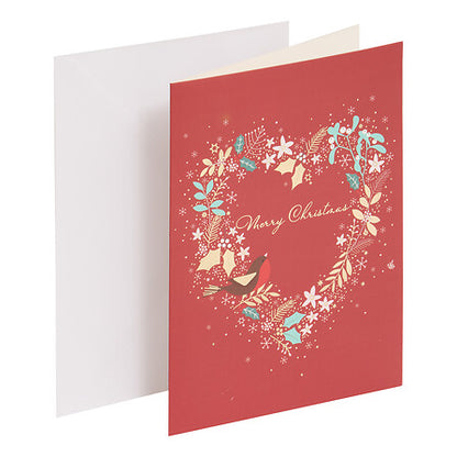 Carte de vœux Noël rouge avec couronne florale en cœur et oiseaux, décoration festive élégante