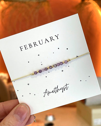 Bracelet cordon ajustable pierre de naissance améthyste février perles violettes et dorées femme