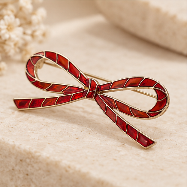 Broche noeud rouge en métal doré style ruban candy cane épinglette femme accessoire mode élégant