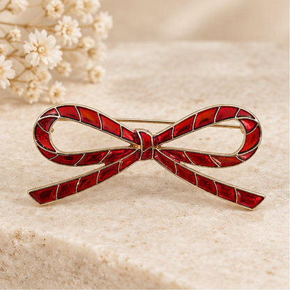 Broche noeud rouge émaillée avec liserés dorés, épinglette élégante style candy cane pour femme