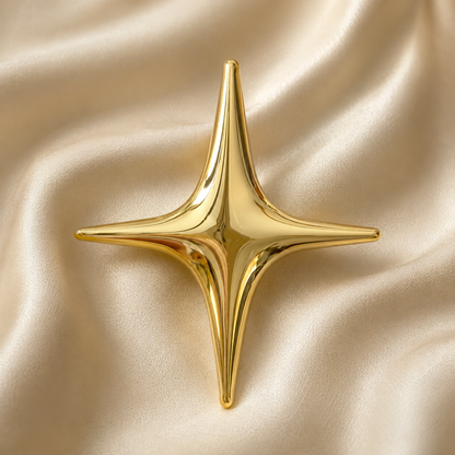 Broche étoile polaire dorée brillante quatre branches style minimaliste bijou femme accessoire mode élégant