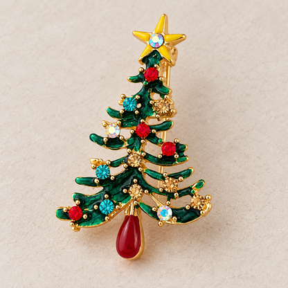 Broche sapin de Noël dorée ornée de strass colorés rouge bleu et étoile jaune accessoire bijou fantaisie fêtes femme