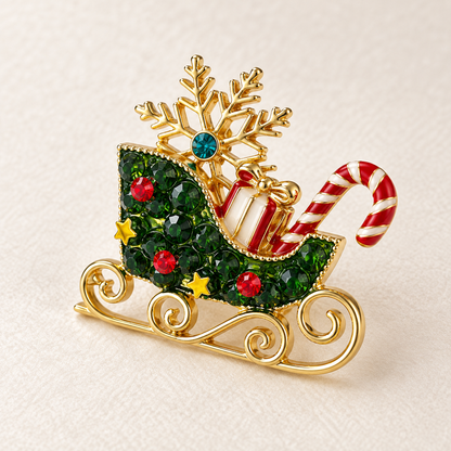 Broche traîneau Père Noël dorée avec cristaux verts, flocon de neige et sucre d'orge, accessoire bijou fantaisie Noël femme