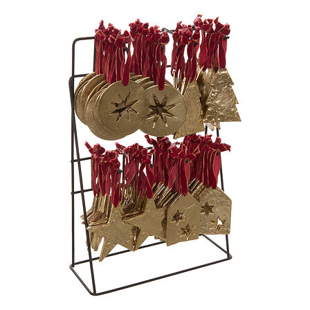Sujets décoratifs métal doré étoiles et sapins avec rubans rouges sur présentoir, décoration sapin Noël tendance