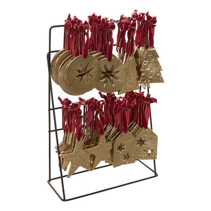 Sujets décoratifs métal doré étoiles et sapins avec rubans rouges sur présentoir, décoration sapin Noël tendance
