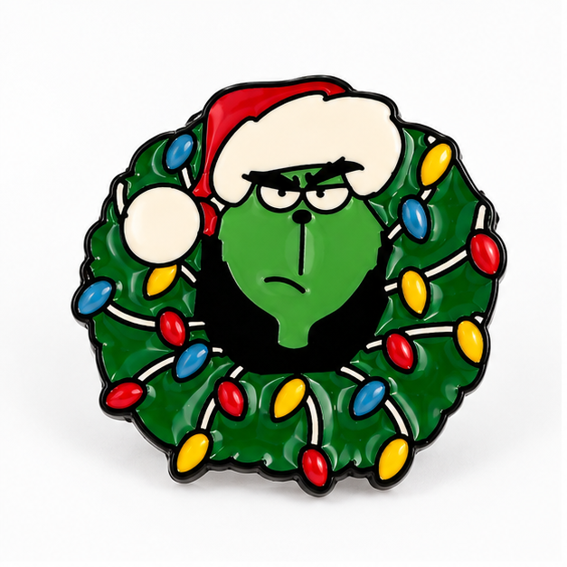 Pin's Grinch Noël en émail vert avec couronne lumineuse colorée et bonnet rouge, accessoire fantaisie fêtes de fin d'année
