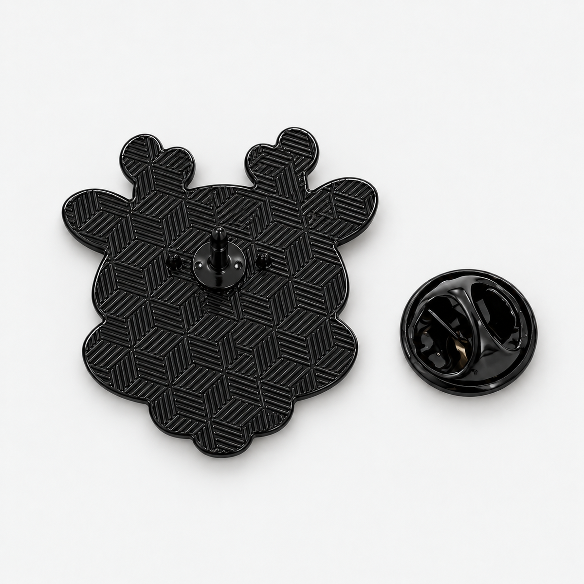 Pin's renne de Noël noir métallique avec dos texturé géométrique et attache papillon, accessoire fantaisie fêtes