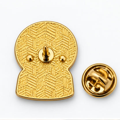Pin's boule à neige doré finition métal avec motif géométrique gravé et fermoir papillon accessoire mode original