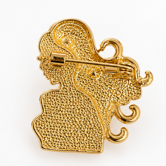 Broche dorée signe astrologique femme silhouette cheveux bouclés style vintage bijou fantaisie constellation